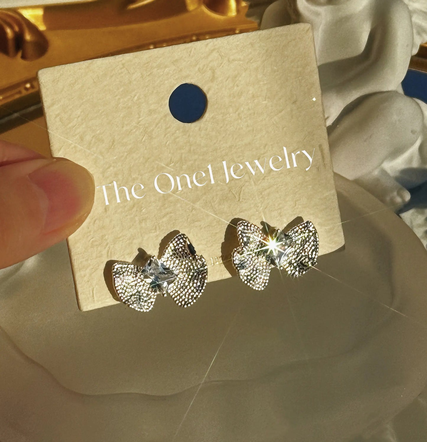 The One1- Silver Bow Crystal Earrings